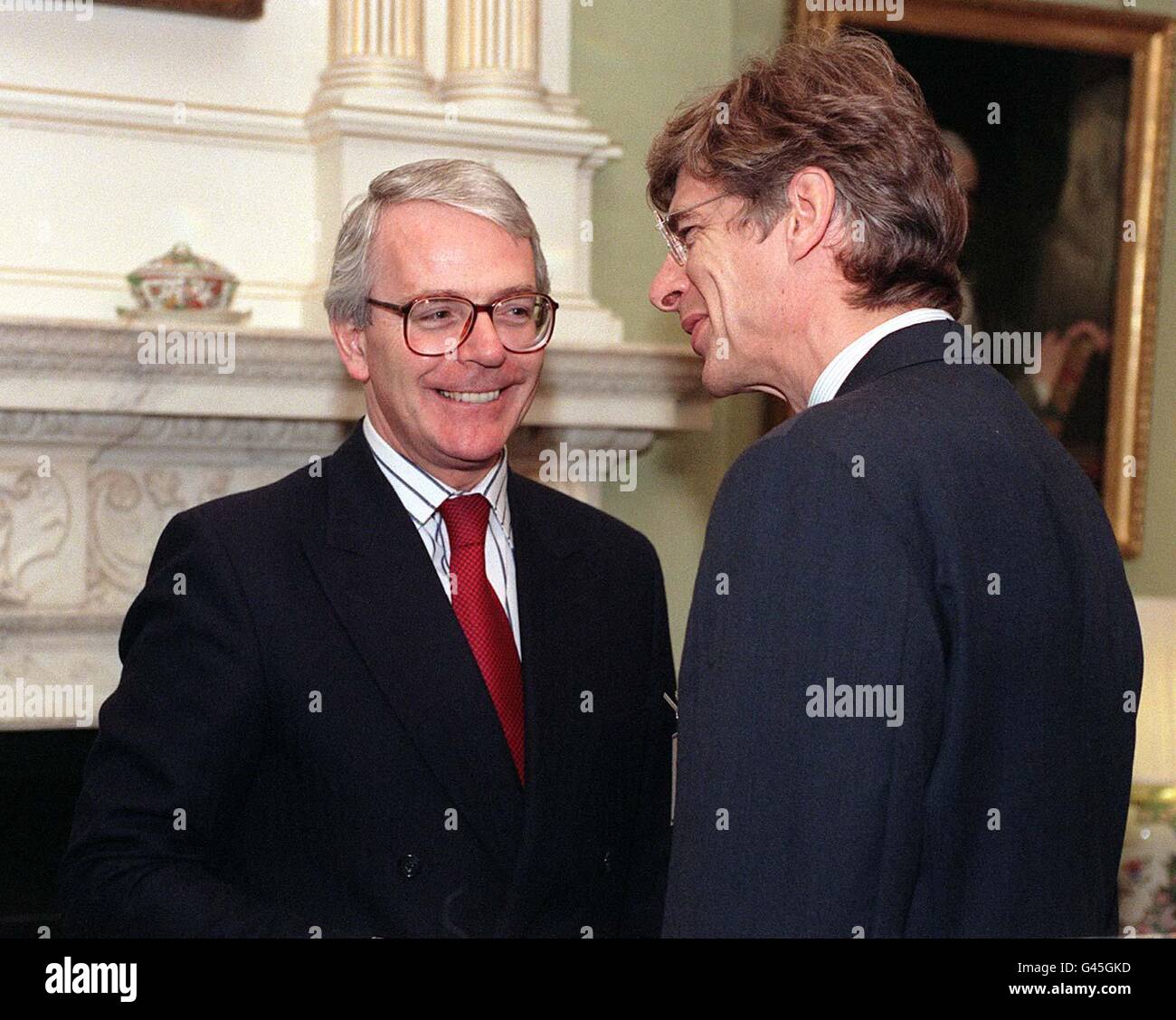 Prime minister john major left with arsenal manager arsene wenger 