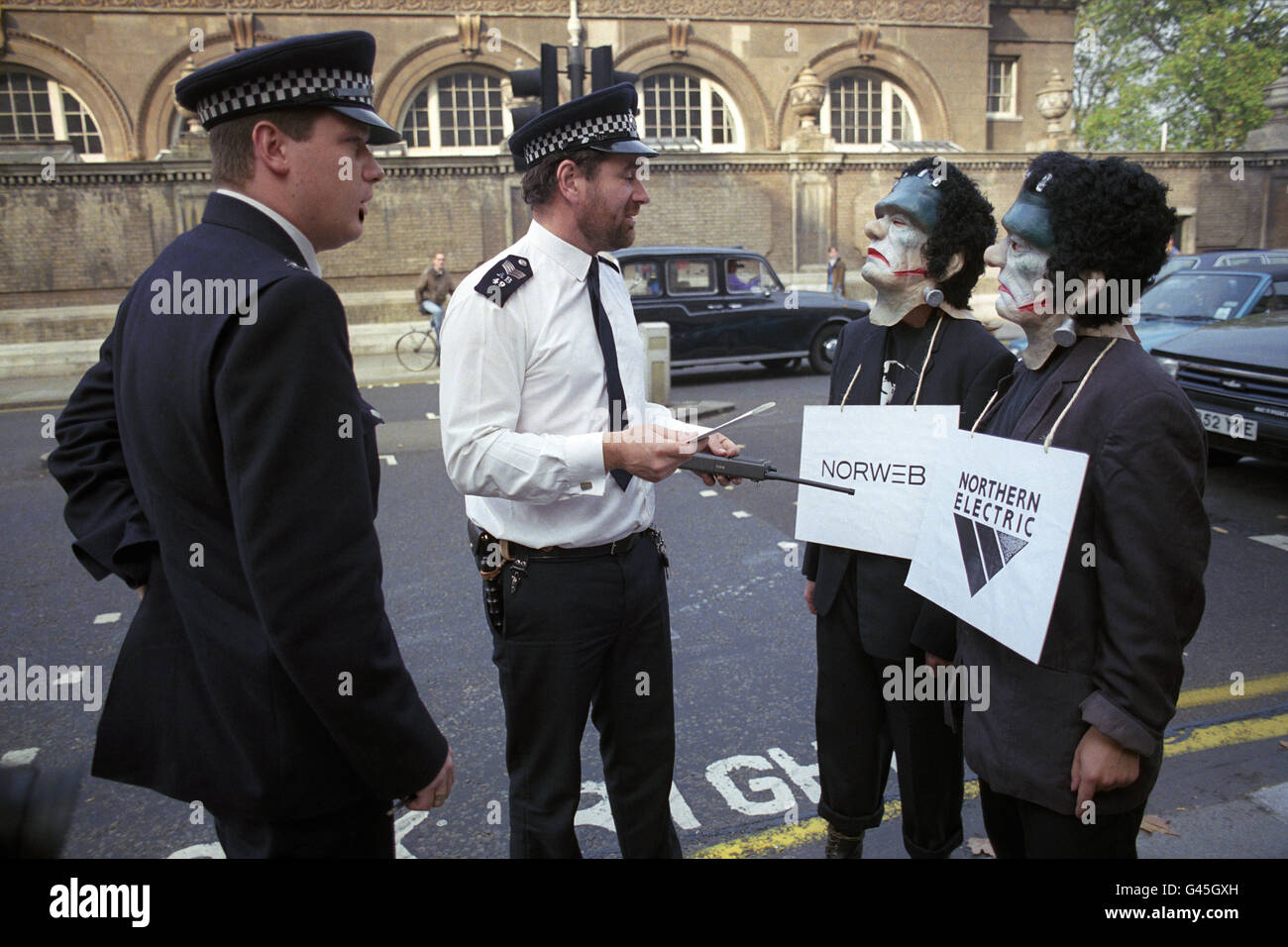 Friends of the Earth protesters, dressed in Frankenstein outfits, are told to move on by police during a demonstration against government plans to privatise the electricity industry, outside the Department of Energy, London Stock Photo