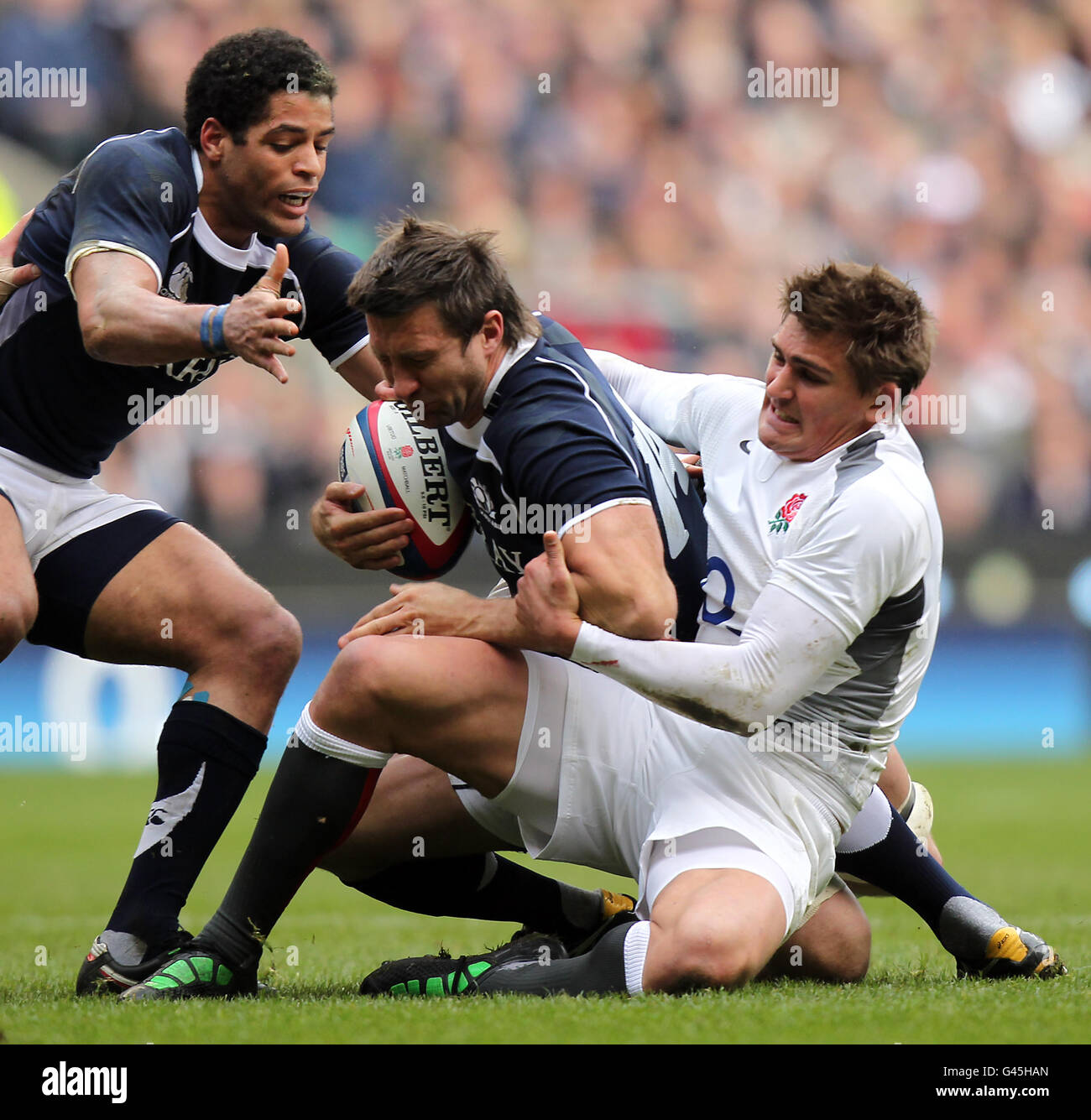 Rugby Union - RBS 6 Nations Championship 2011 - England v Scotland - Twickenham. England's Toby Flood (right) tackles Scotland's Simon Danielli Stock Photo