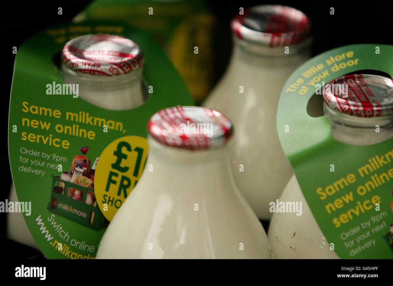 Labels on Dairy Crest milk promoting their online delivery service in Greater Manchester. Stock Photo