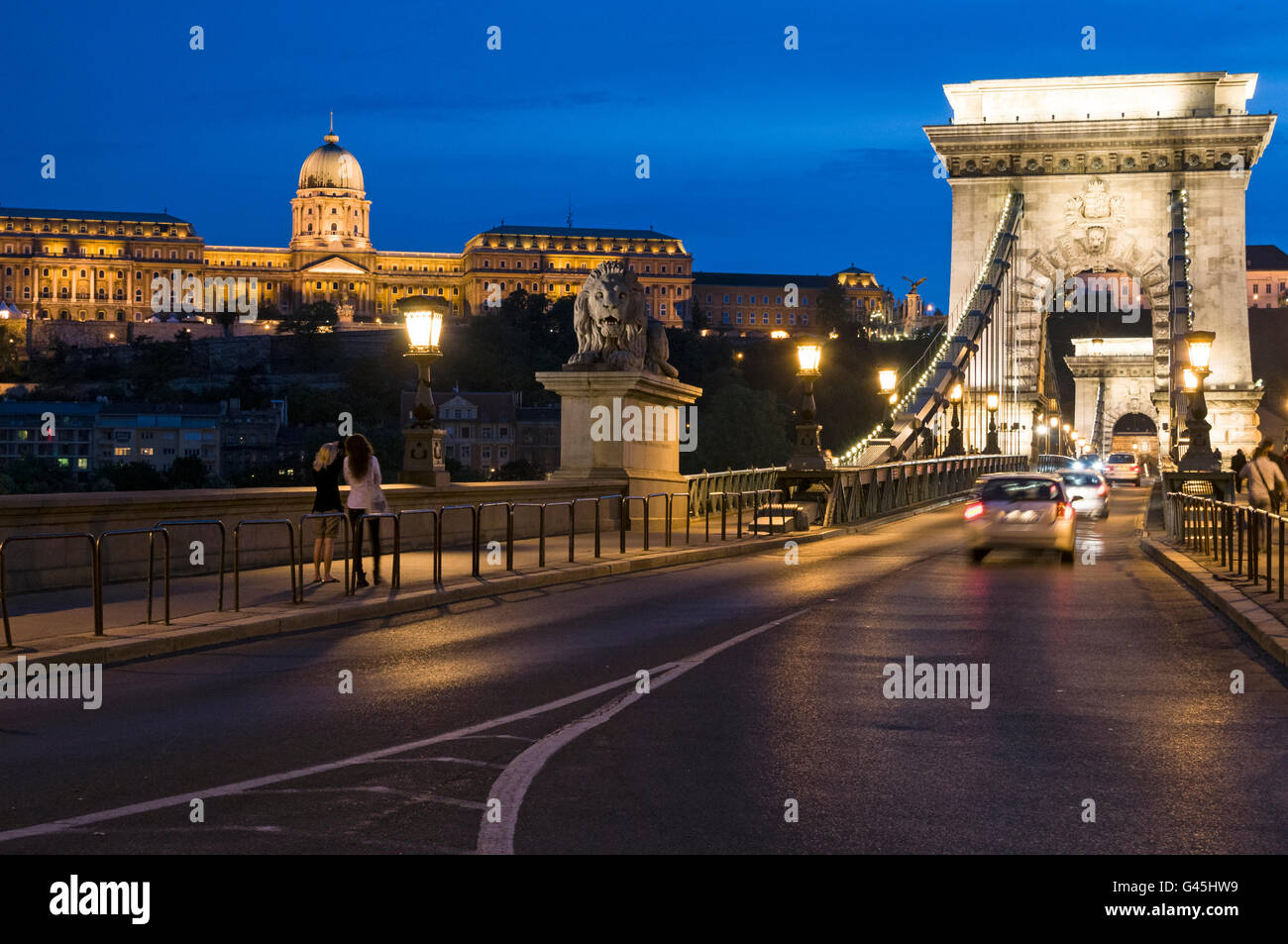 The former Royal Palace and the oldest bridge, Széchenyi Chain Bridge in Budapest in Hungary.  The Chain bridge was designed by Stock Photo