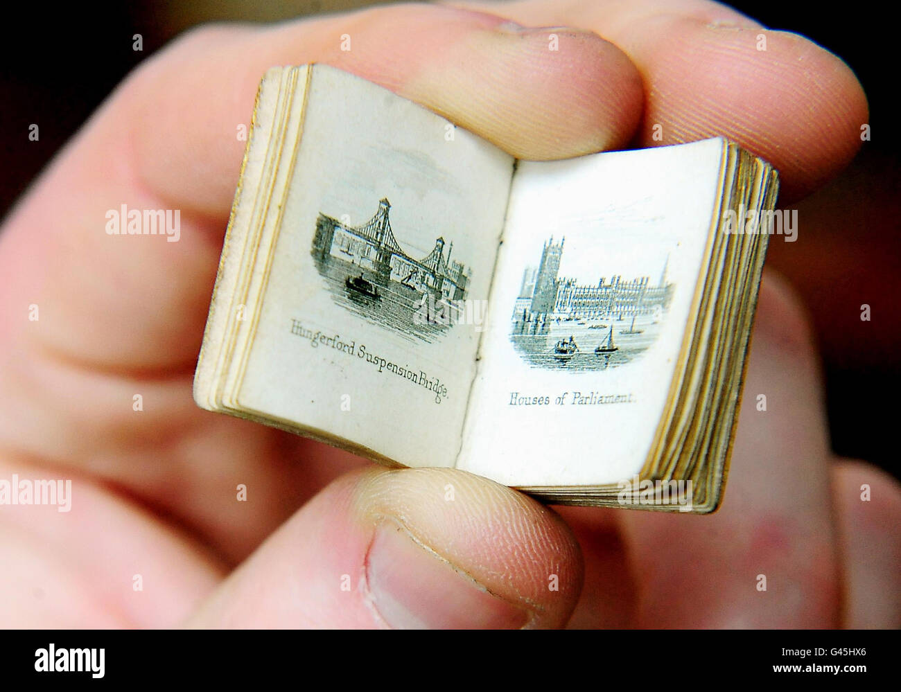 Dean Roe holds a miniature 19th century Bijou Picture of London, which is to be auctioned on Thursday at Bamfords Auctioneers in Derby. Stock Photo