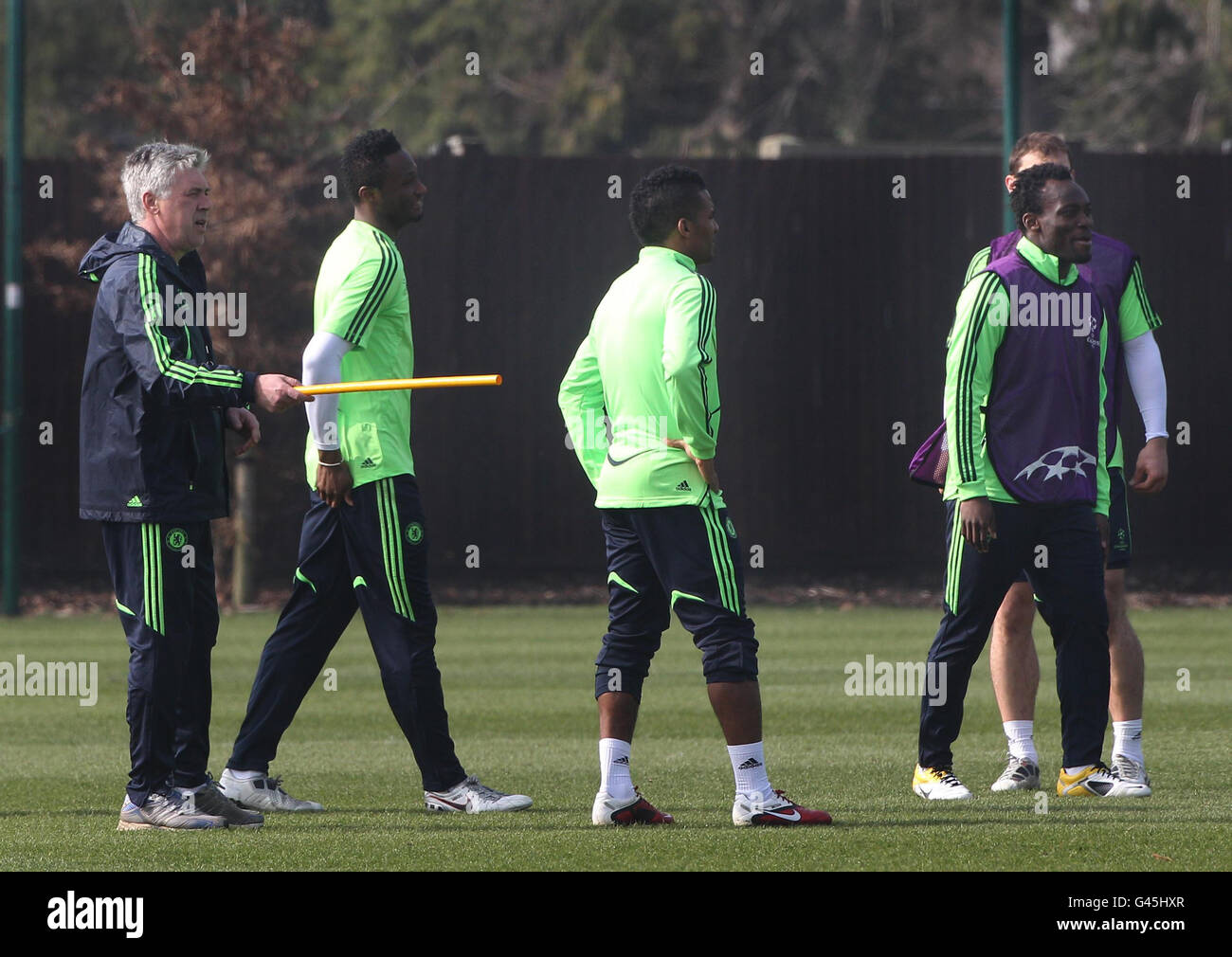 Chelsea Manager Carlos Ancelotti uses a plastic pole as he gives his instructions to his players during a training session at Cobham Training Ground, London. Stock Photo