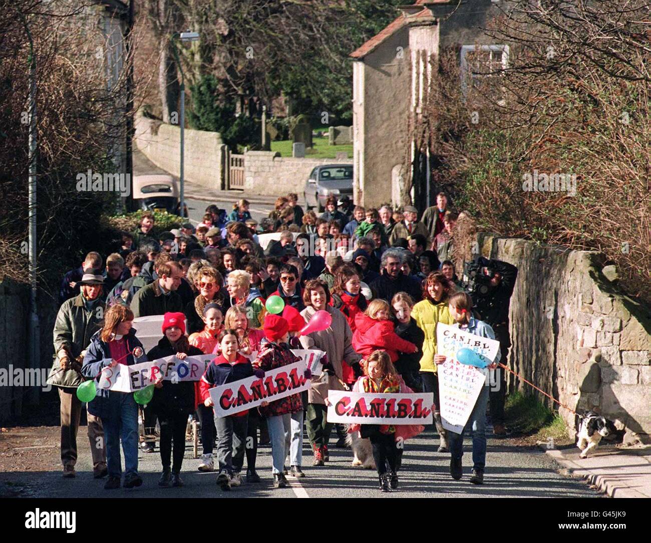 Residents of Burton Leonard march around their village today (Sunday