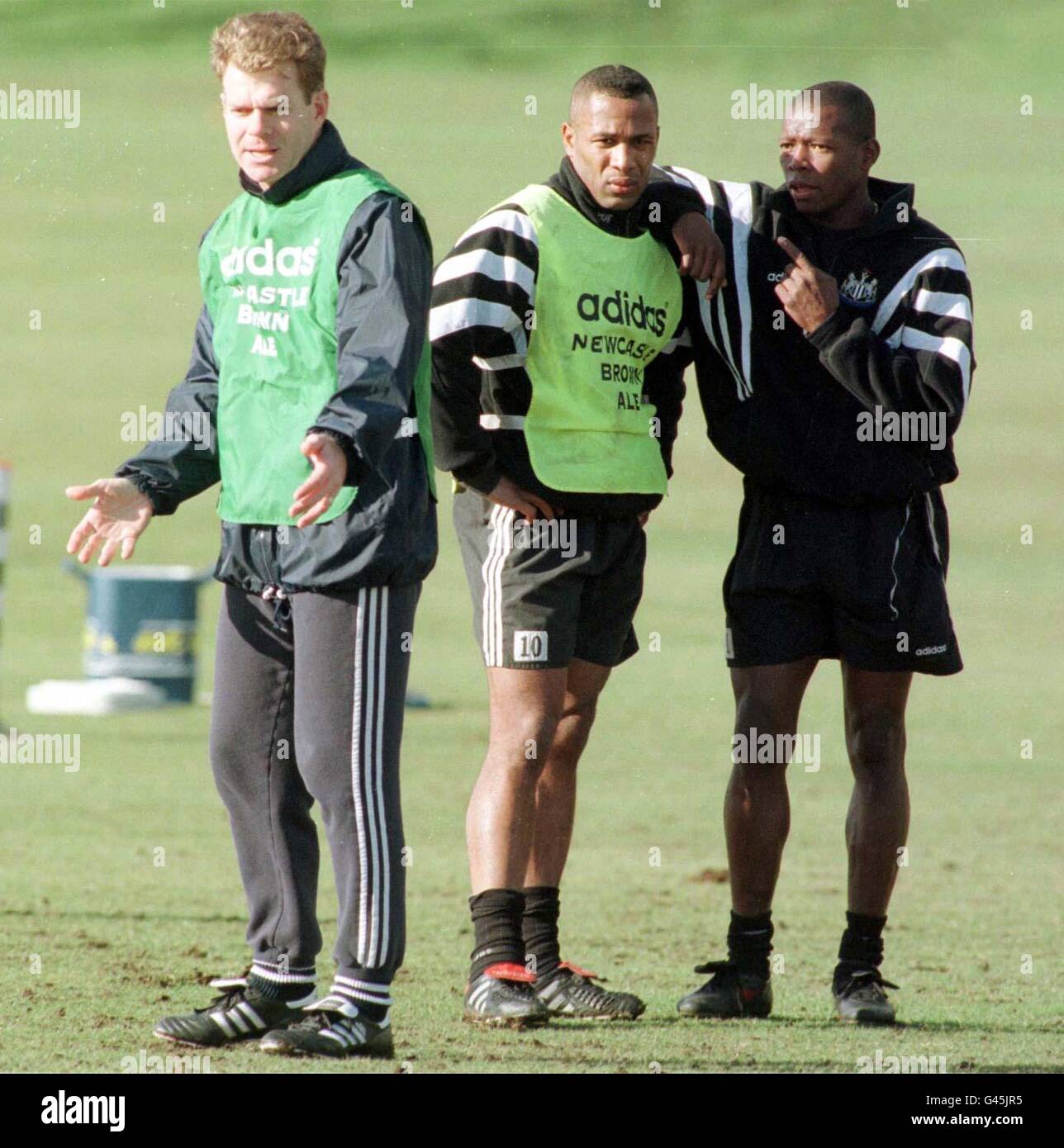 The new strike force Les Ferdinand talks with Asprilla at the Newcastle camp today (Friday). The team face Southampton in the Premier League tomorrow. Photo by Owen Humphreys/PA. **Man on left un-identified** Stock Photo