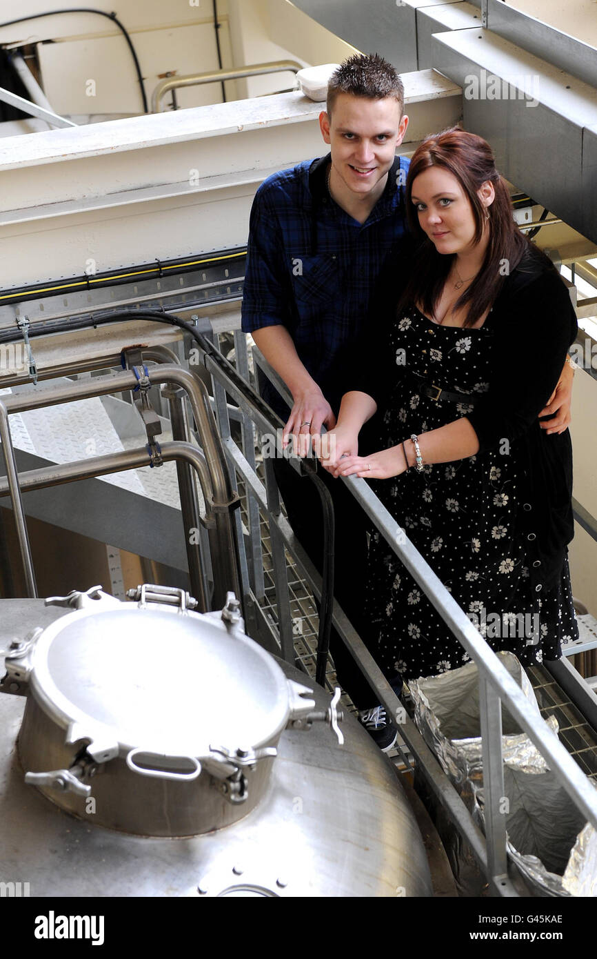 Nottingham couple Toni Newbold and fiance Adam Sandy, who are getting married on the same day as Prince William and Kate Middleton, after adding English hops to Castle Rock Brewery's traditional ale Kiss Me Kate, during a visit to the brewery in Nottingham. Stock Photo