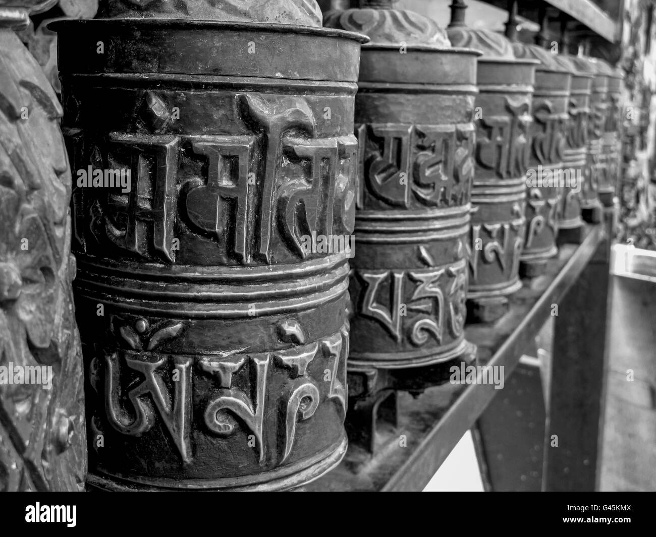 Praying wheels in a temple in Kathmandu, Nepal Stock Photo