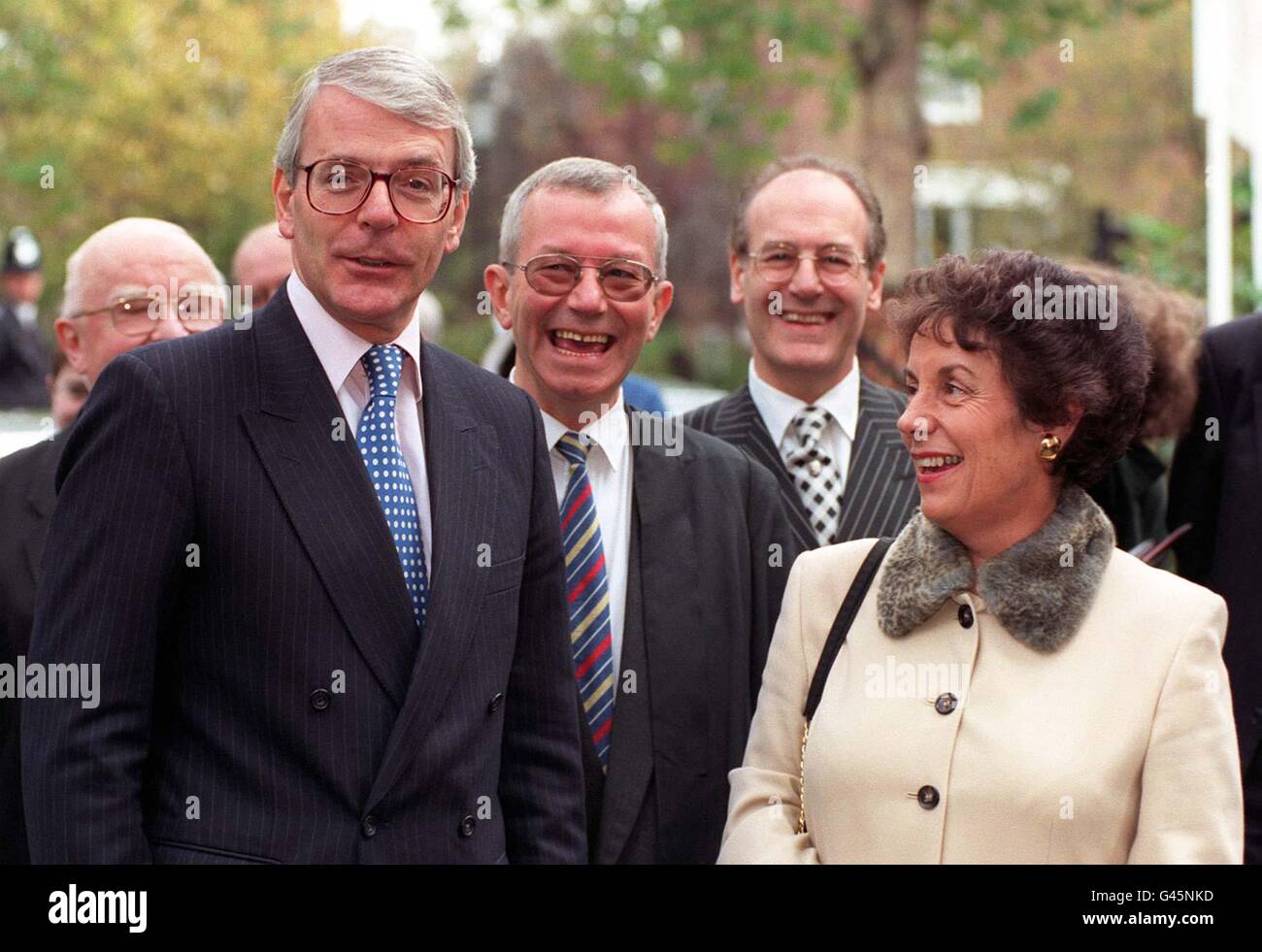 Prime Minister John Major shares a jokes with his Education Secretary Gillian Shephard on their arrival at the Cardinal Vaughan Memorial School in Kensington, one of London's top grant maintained schools. The visit coincides with the launch of the Government's Education Bill, published today (Wednesday). Photo by Fiona Hanson /PA. SEE PA STORY POLITICS Education Major. **Man in centre of pic un-identified** Stock Photo
