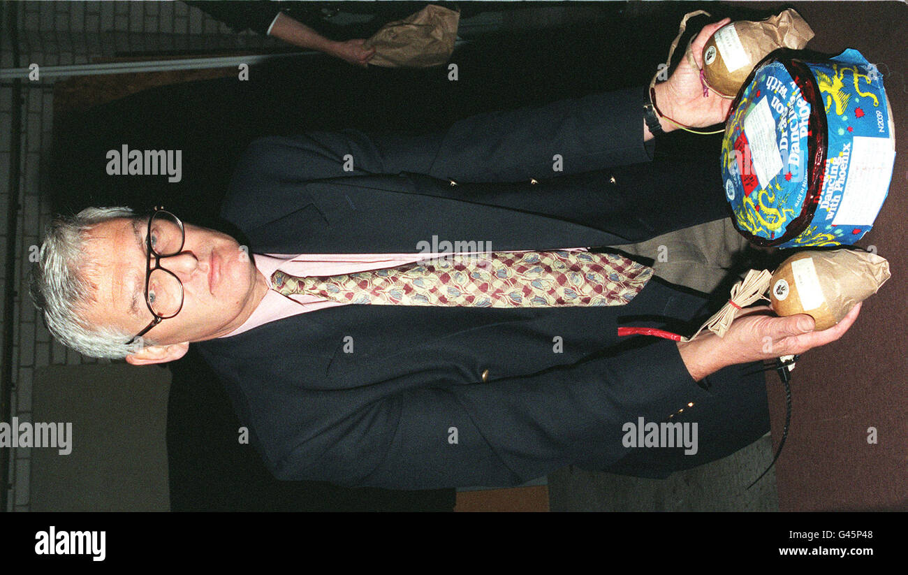 Kent Trading Standards officer Mr John Simmonds holds Chinese imported firework's called one of which is called a 'Grand Celebration' retrieved from a private residence after a father of two at Willmington, near Dartford in Kent was killed when a similair firework exploded last night (Saturday). See PA Story FIREWORK Accident. Photo by Derek Cox/PA. Stock Photo