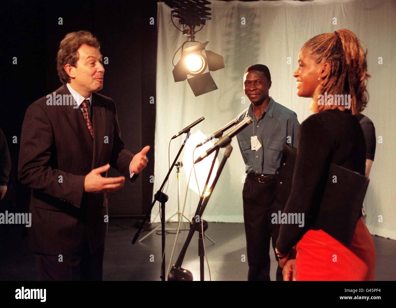 Labour leader Tony Blair gestures to Maureen Raphael (R) in a ...