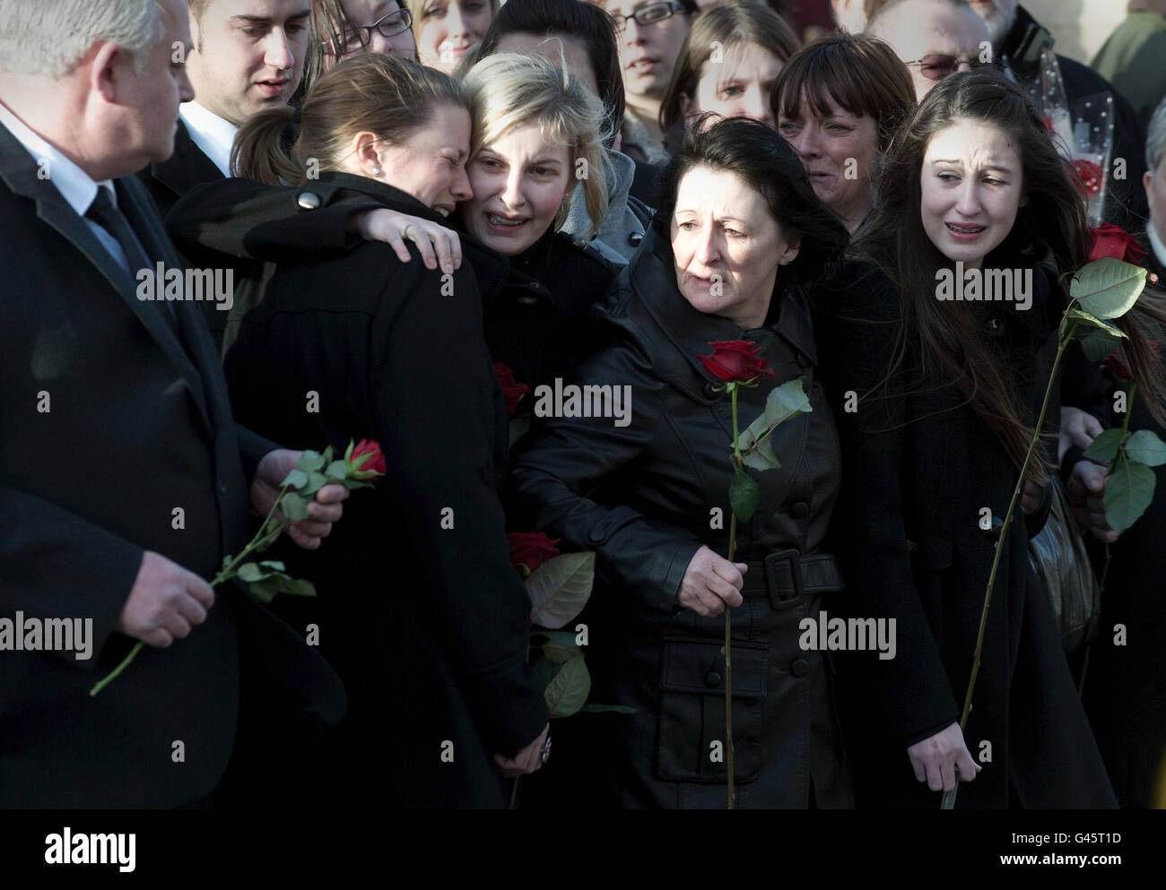 Laura Tasker Lance Corporal Liam Tasker's sister Laura Tasker (centre) comforts his ...