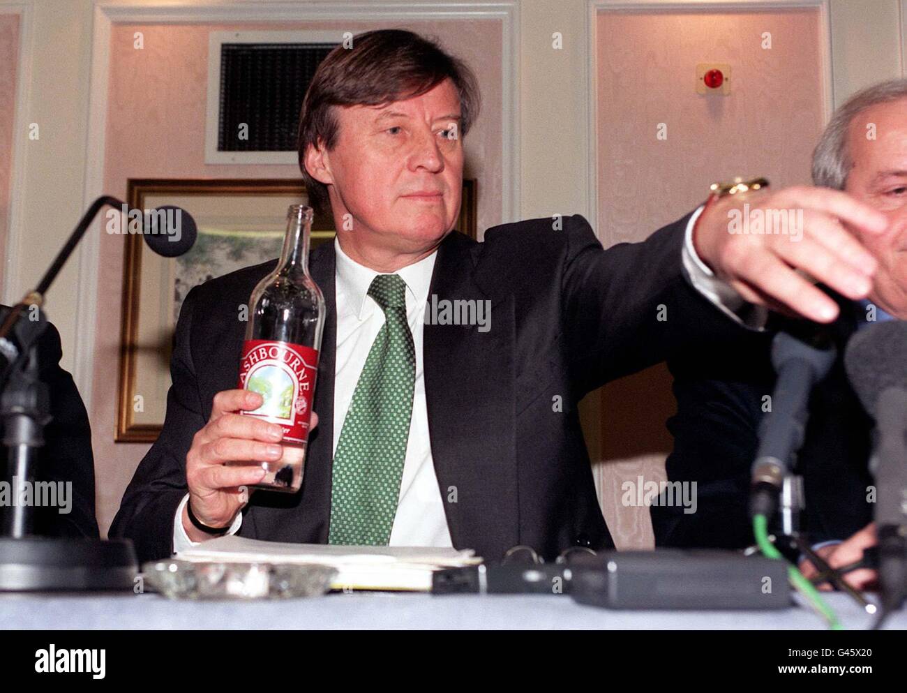 German General Secretary of UEFA Gerhard Aigner reaches for a glass as he  speaks to the press at a meeting today (Friday) at the Kensington Palace  Hotel in London regarding the rival