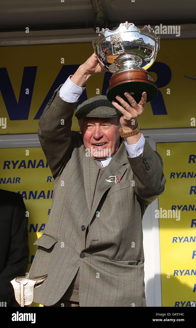 Owner Trevor Hemmings lifts the trophy after his horse Albertas Run won