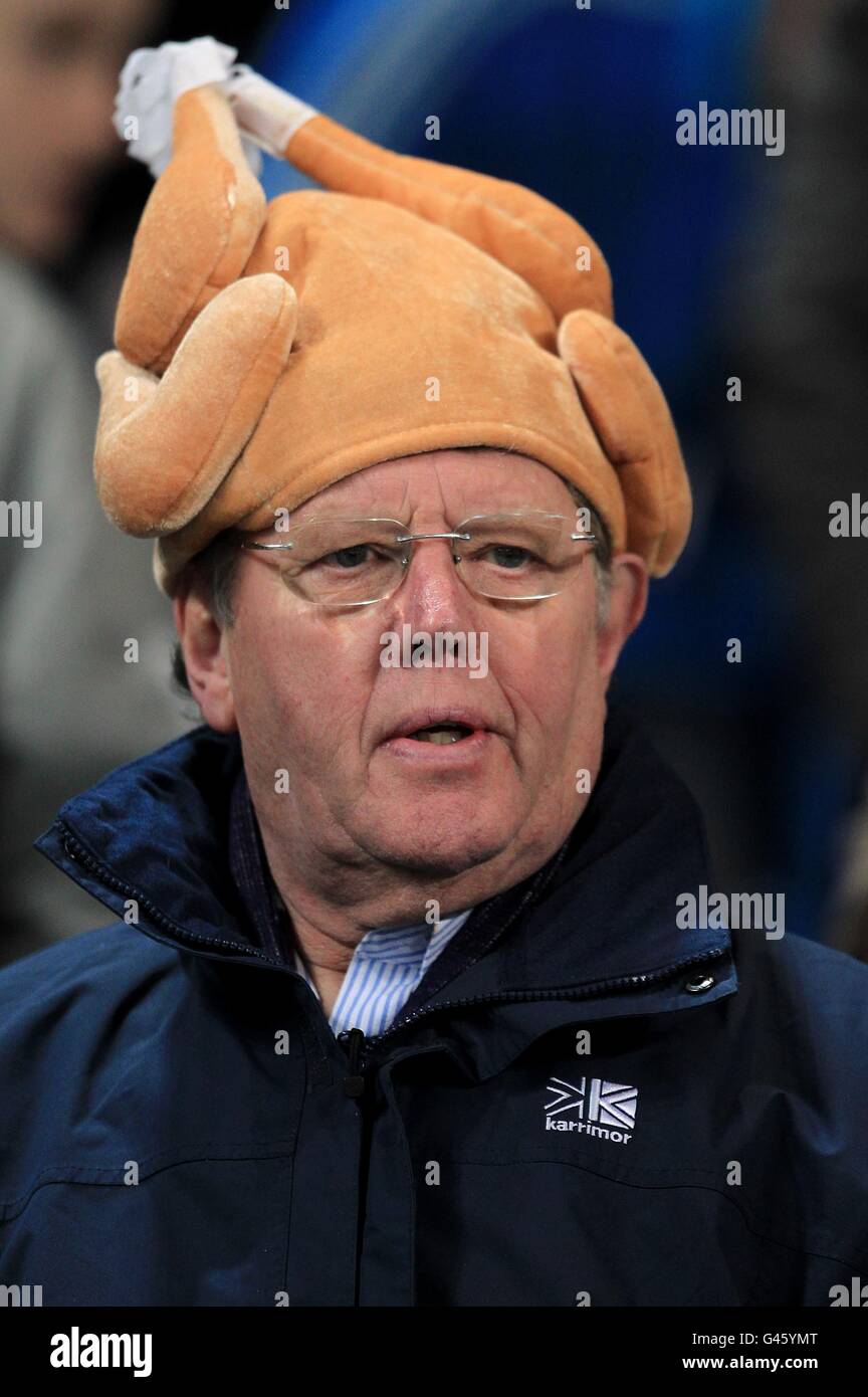A fan wears a chicken hat in the stands hires stock photography and images Alamy