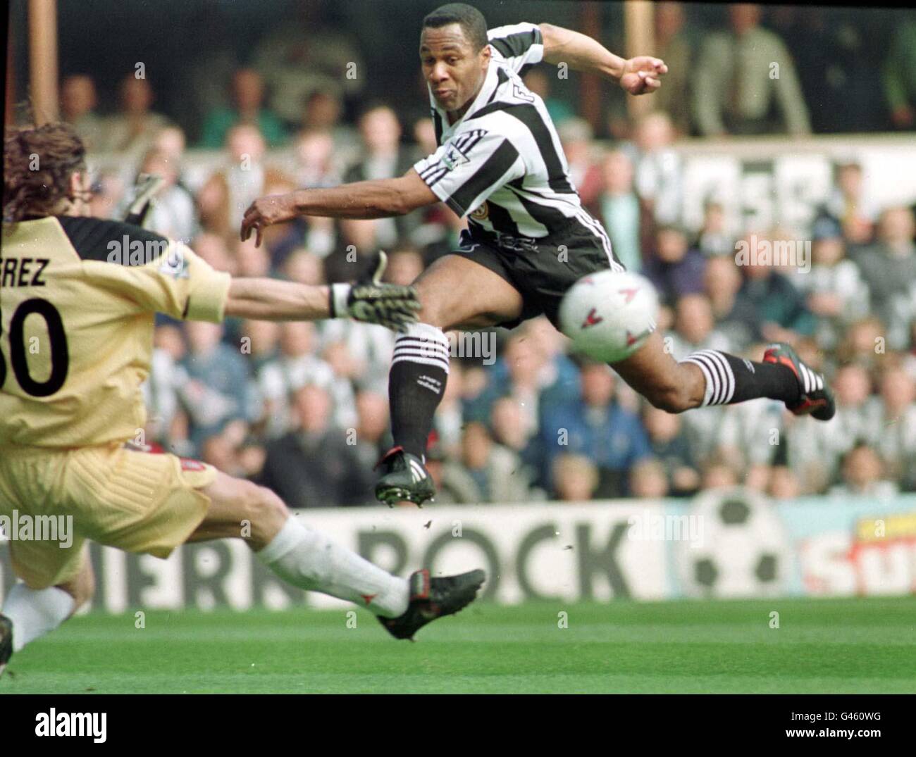 Newcastle's Les Ferdinand just shoots wide of Sunderland's Lionel Perez in the local Derby at St James' Park today (Sat). Photo by Owen Humphreys/PA Stock Photo