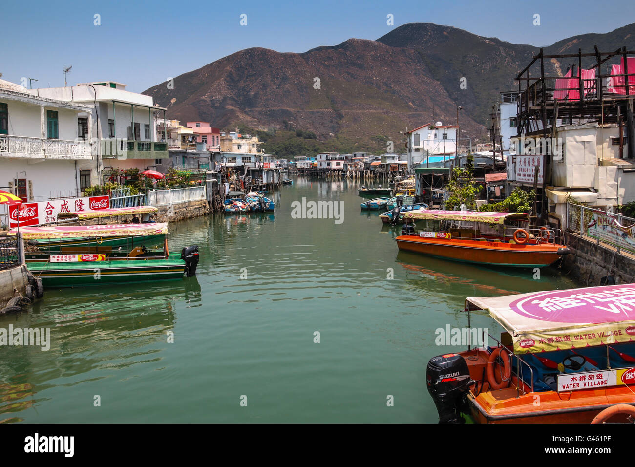 Hong Kong - April 10, 2011: Houses on stilts above the tidal flats of Lantau Island are homes to the Tanka people in Tai O. Stock Photo