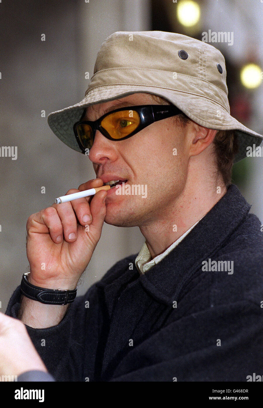 ACTOR / SINGER JASON DONOVAN SMOKES A CIGARETTE AT THE LAUNCH OF STAGEFAIR '96. 8.10.96. PA NEWS. Stock Photo