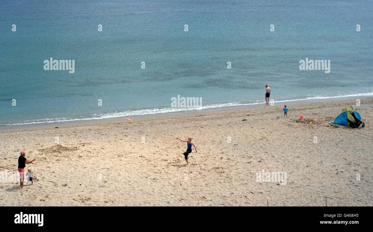 People enjoy themselves on Towan Beach in Cornwall, Britain June 16, 2016. Copyright photograph John Voos Stock Photo