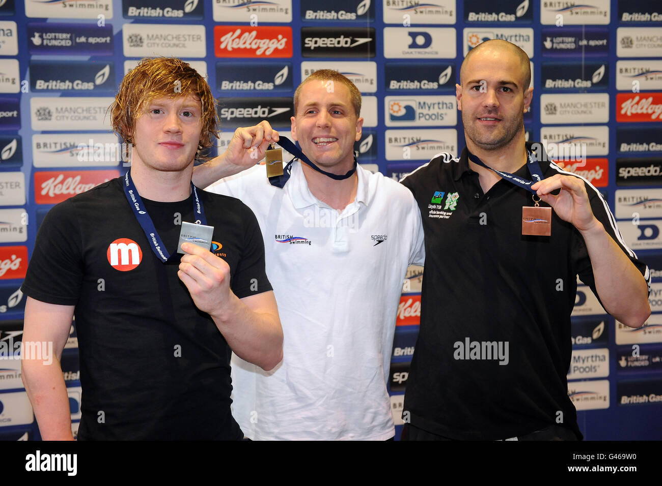 Marple's Matthew Walker (centre), CIty of Manchester's Simon Miller (left) and Caerphilly's David Roberts celebrate winning Gold, Silver and Bronze in the Men's MD 50m Freestyle Final Stock Photo