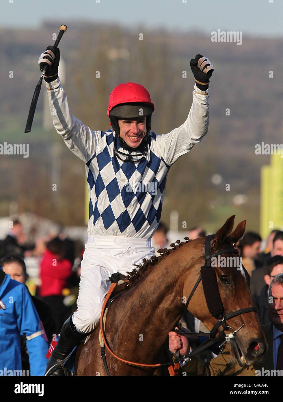 Jockey Derek O'Connor celebrates winning the Christie's Foxhunter Chase Challenge Cup on Zemsky during Gold Cup Day, at the Cheltenham Festival. Stock Photo