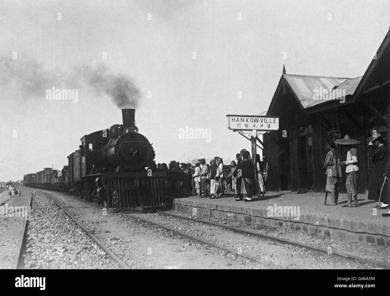 transport - Rail - Trains - Hankow. A venerable steam train pulls into Hankow Railway Station. Stock Photo