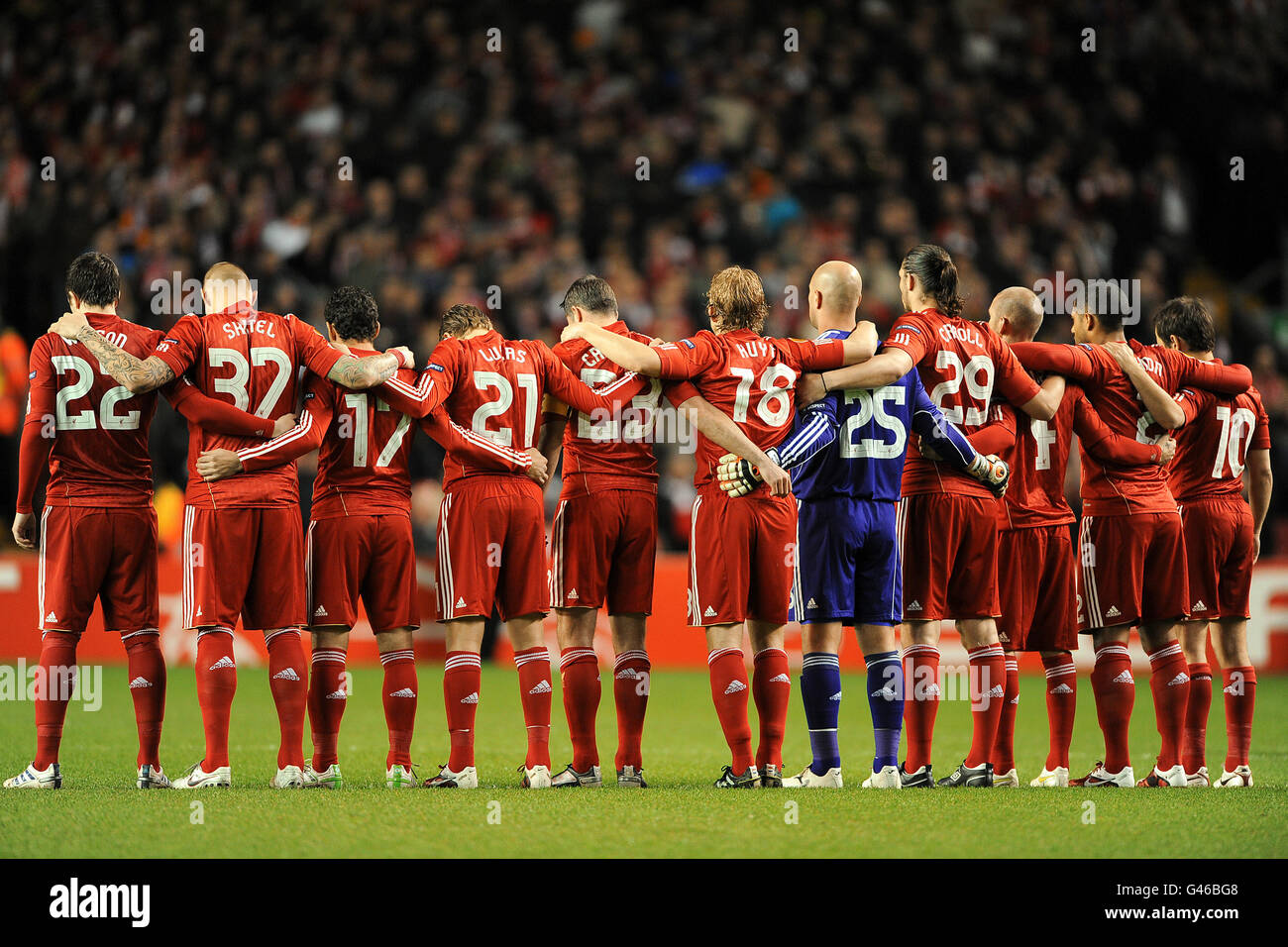 Soccer - UEFA Europa League - Round of 16 - Second Leg - Liverpool v Braga - Anfield. Liverpool players observe a minutes silence for the victims of the Japanese earthquake Stock Photo