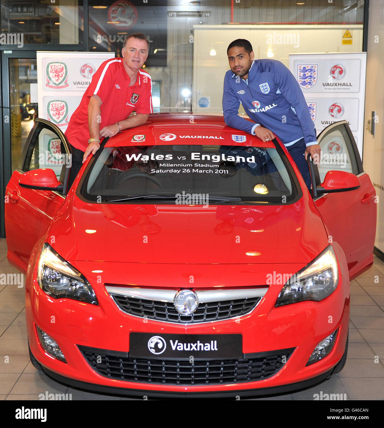*STRICT EMBARGO UNTIL 2300, MONDAY MARCH 21, 2011* Liverpool and England player Glen Johnson with former Everton and Wales player Kevin Ratcliffe during a visit to the Astra production line and the Vauxhall factory in Ellesmere Port, Cheshire. Stock Photo