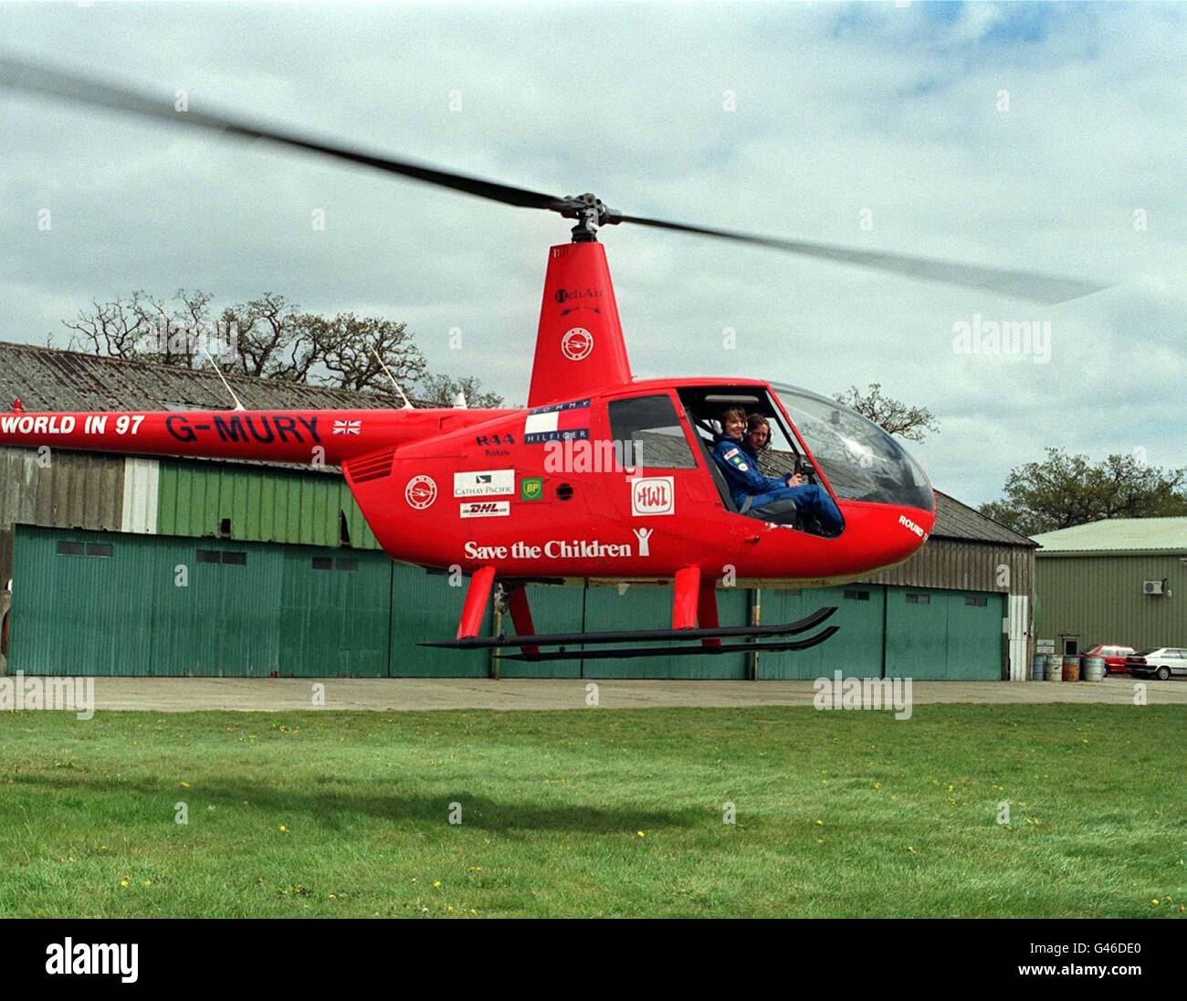 Jennifer Murray, a 56-year-old grandmother, is poised to fly into the record books as the first woman to pilot a helicopter around the world. This pioneering trip, which aims to raise 500,000 for Save The Children, takes off on May 10, 1997, from Denham, Middlesex, where Jennifer is pictured today with co-pilot Quentin Smith, 32. Photo by Sam Pearce. Stock Photo