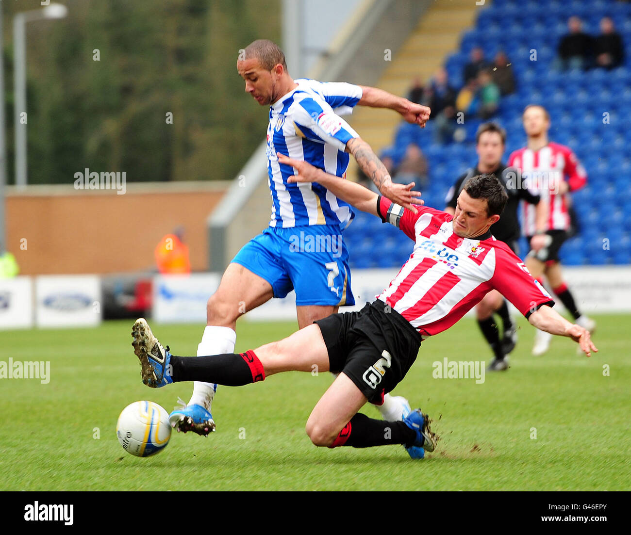 Soccer - npower Football League One - Colchester United v Exeter City - The Weston Homes Community Stadium. Exeter City's Steve Tully fouls Colchester United's Ashley Vincent resulting in him getting a red card Stock Photo