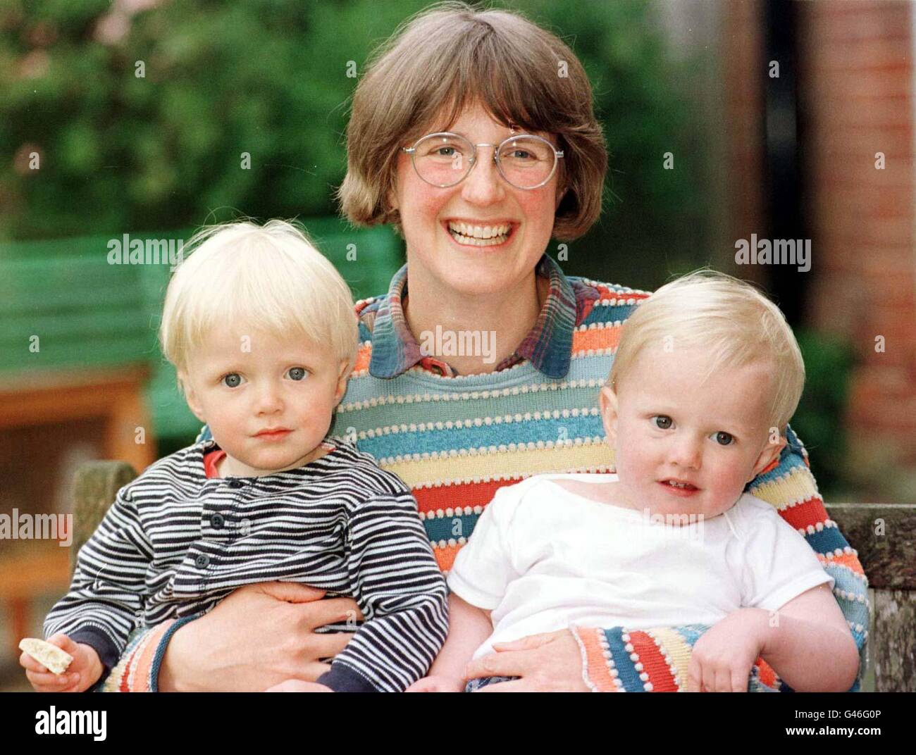 Authoress and illustrator of children books Lucy Cousins with her 1 year old twins Ben (Left) and Rufus (Right) at her home near Petersfield Hants. Her series of books about 'Maisy Mouse' have proved popular with children throughout the world. See PA story ARTS Mouse. Photo Tim Ockenden/PA Stock Photo