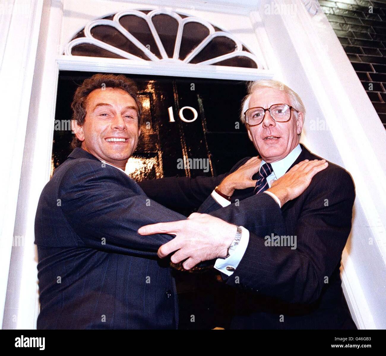 The struggle for Number 10 Downing Street intensifies, with look-a-likes John Major (right, Peter Friel) and Tony Blair (Michael Aidan Ross) getting to grips on the Granada TV Studio Tours Downing Street set in Manchester today (Monday). Pic Dave Kendall. Stock Photo