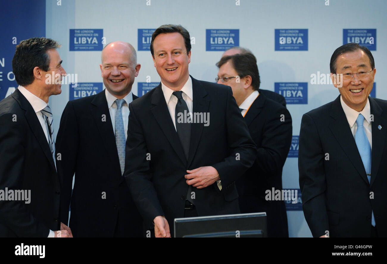 British Prime Minister David Cameron (centre) is pictured with his foreign secretary William Hague (2nd left), NATO Secretary General Anders Fogh Rasmussen (left) and UN Secretary General Ban Ki Moon (right) at the opening meeting of the Libya Conference in London. Stock Photo