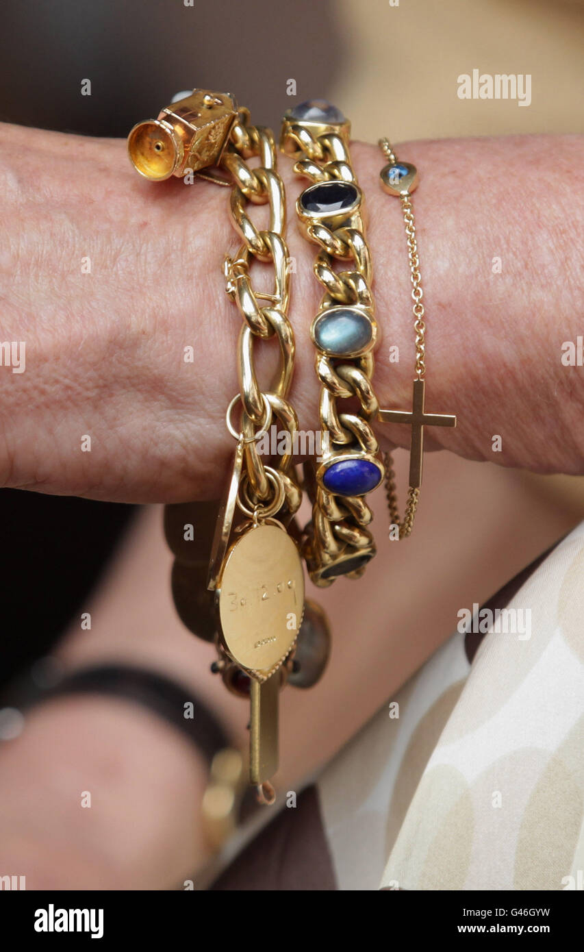 A close-up view of jewellery worn by the Duchess of Cornwall during a visits Casa De Proteccao E Amparo De Santo Antonio, on day two of a two day visit to Portugal with the Prince of Wales. Stock Photo