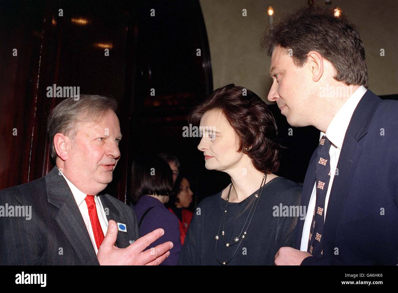 Labour leader Tony Blair (right) and his wife, Cherie Booth, listen to