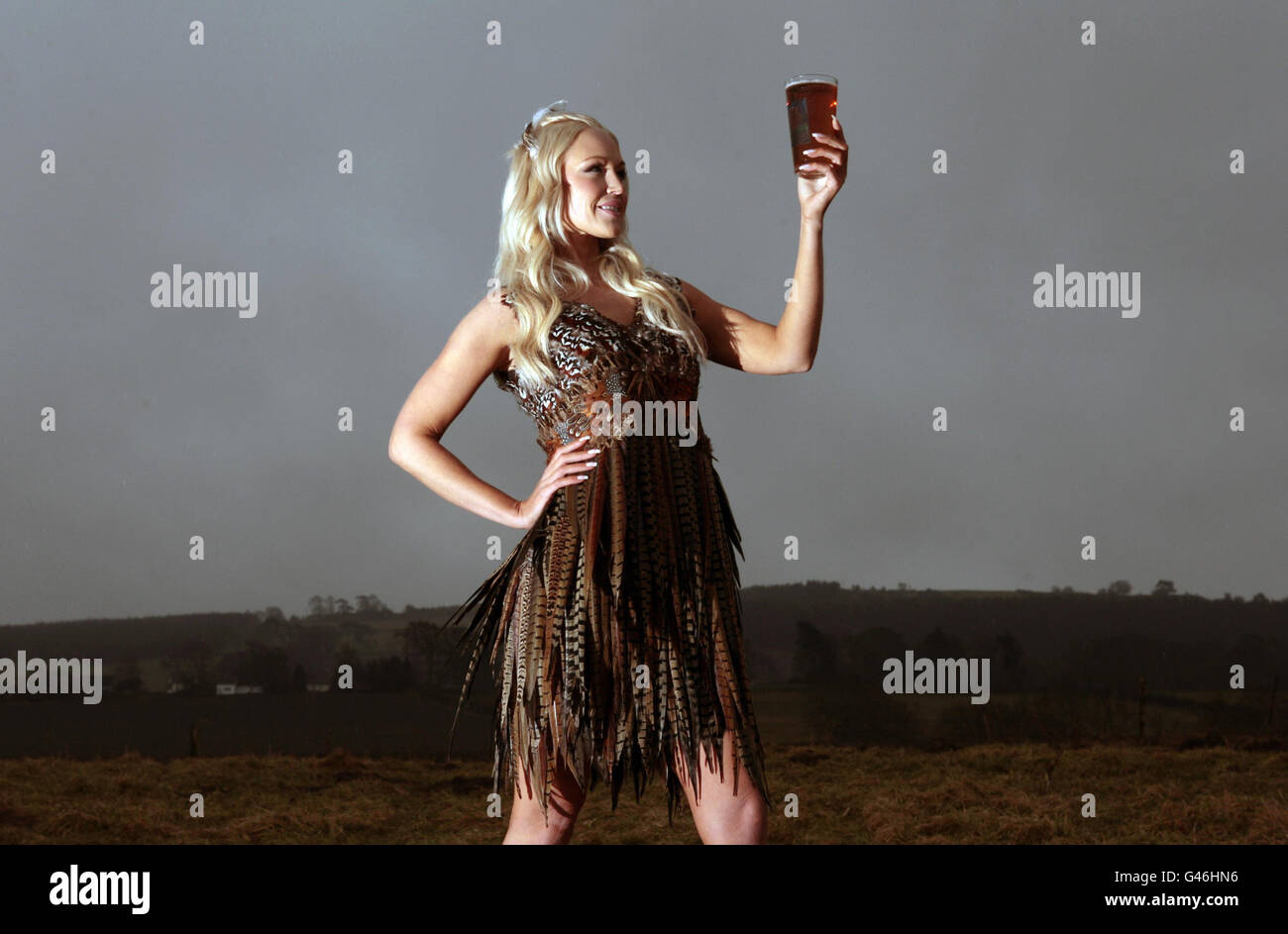 Former Miss Scotland Lois Weatherup in a dress made from Pheasant feathers for the launch of Foxy Blond, the first new ale from the Scottish Borders Brewery based near Ancrum. Stock Photo