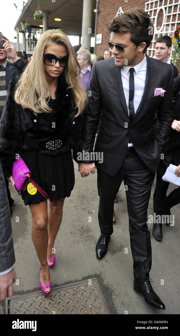Katie Price arrives with Leandro Penna during the Gold Cup Day at Cheltenham Racecourse. Stock Photo