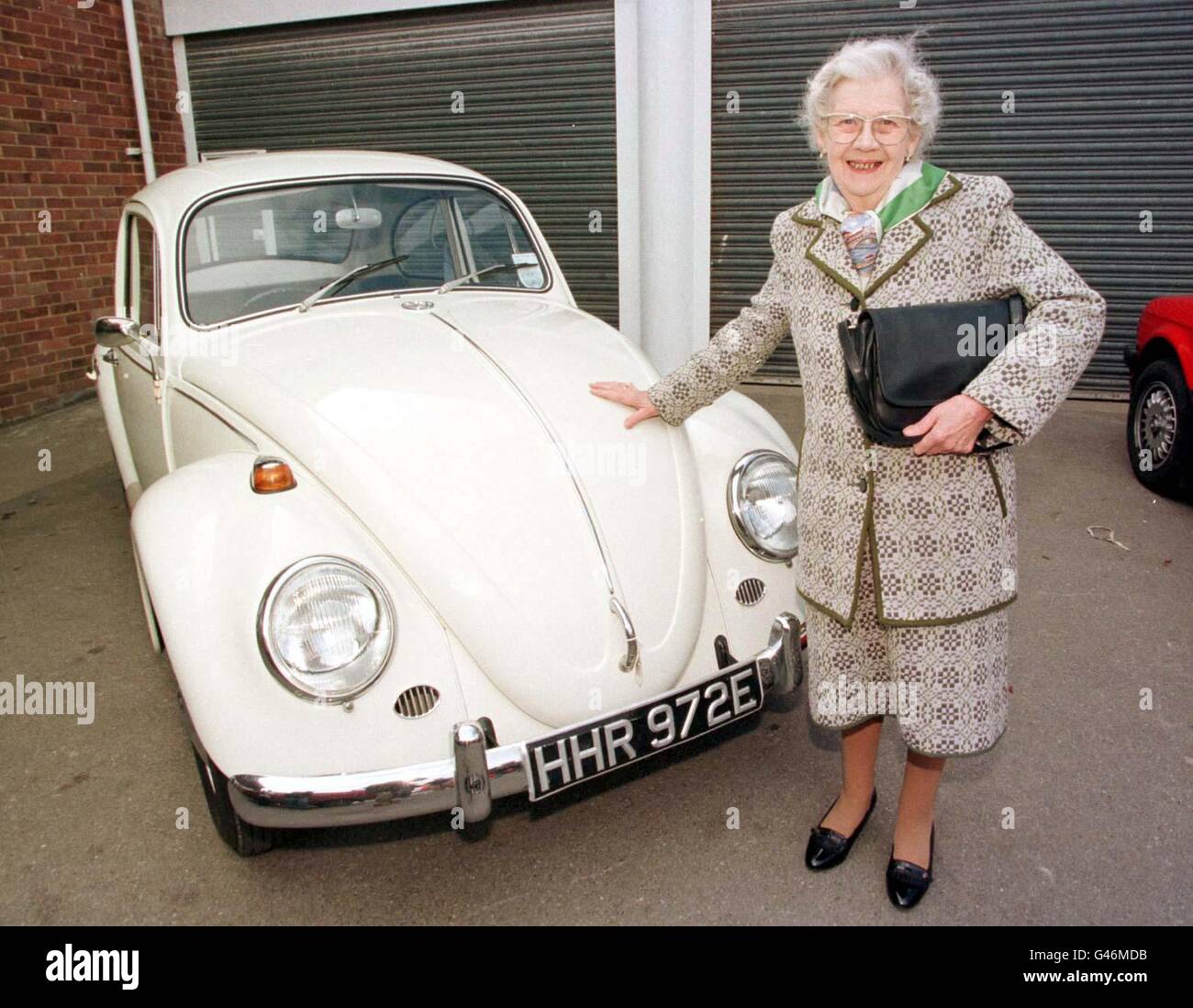 Miss Phyllis Harding, 80, with her 30-year-old Volkswagen Beetle at Woolley & Wallis Auctioneers, Salisbury, today (Wednesday) where she sold the vehicle for 9500. The car, a 1300 de luxe model which she brought from new in February 1967, has only 3485 miles on the clock. Photo by Tim Ockenden/PA. Stock Photo