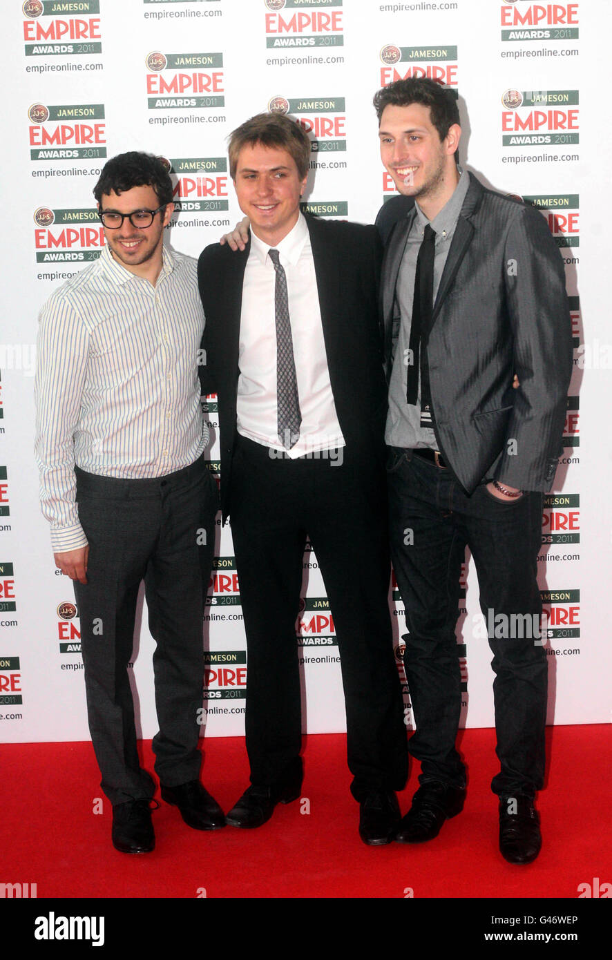 (From the left) Simon Bird, Joe Thomas and Blake Harrison arrive at the Empire Film Awards at the Grosvenor House Hotel in London. Stock Photo