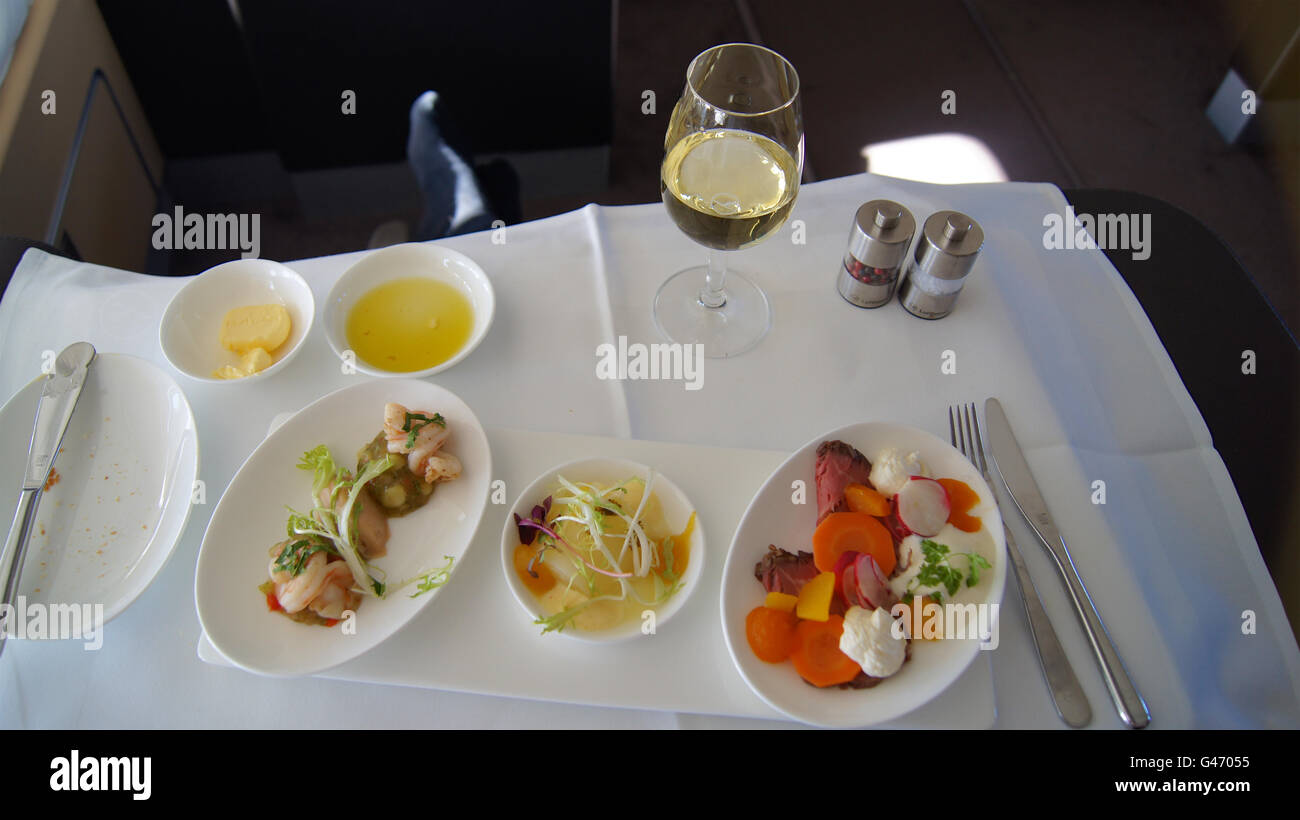SEPTEMBER 2014: First Class Dining onboard an Boeing 747 Stock Photo