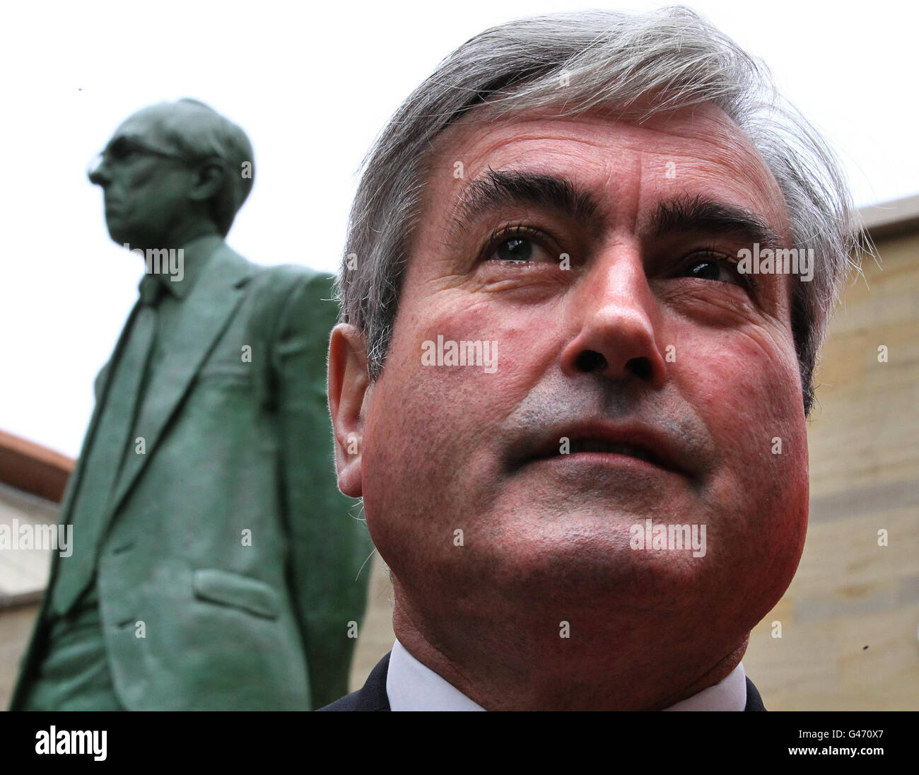 Scottish Labour leader Iain Gray stands near to a statue of former Labour leader Donald Dewar during a walkabout on the Scottish election campaign trail in Glasgow city centre. Stock Photo