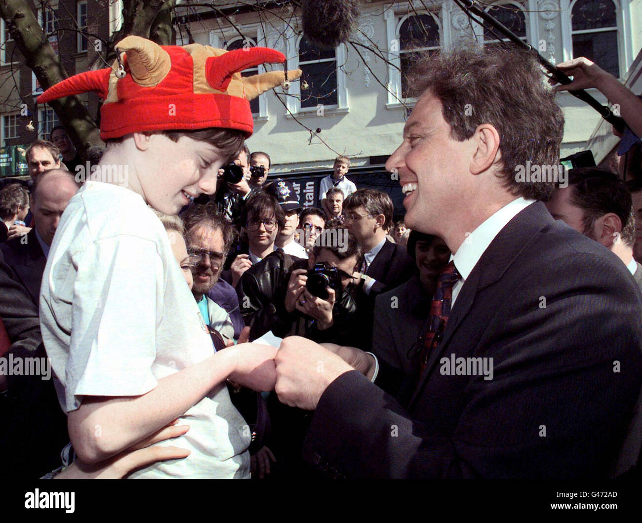Labour leader Tony Blair chats to a young boy in Northampton after