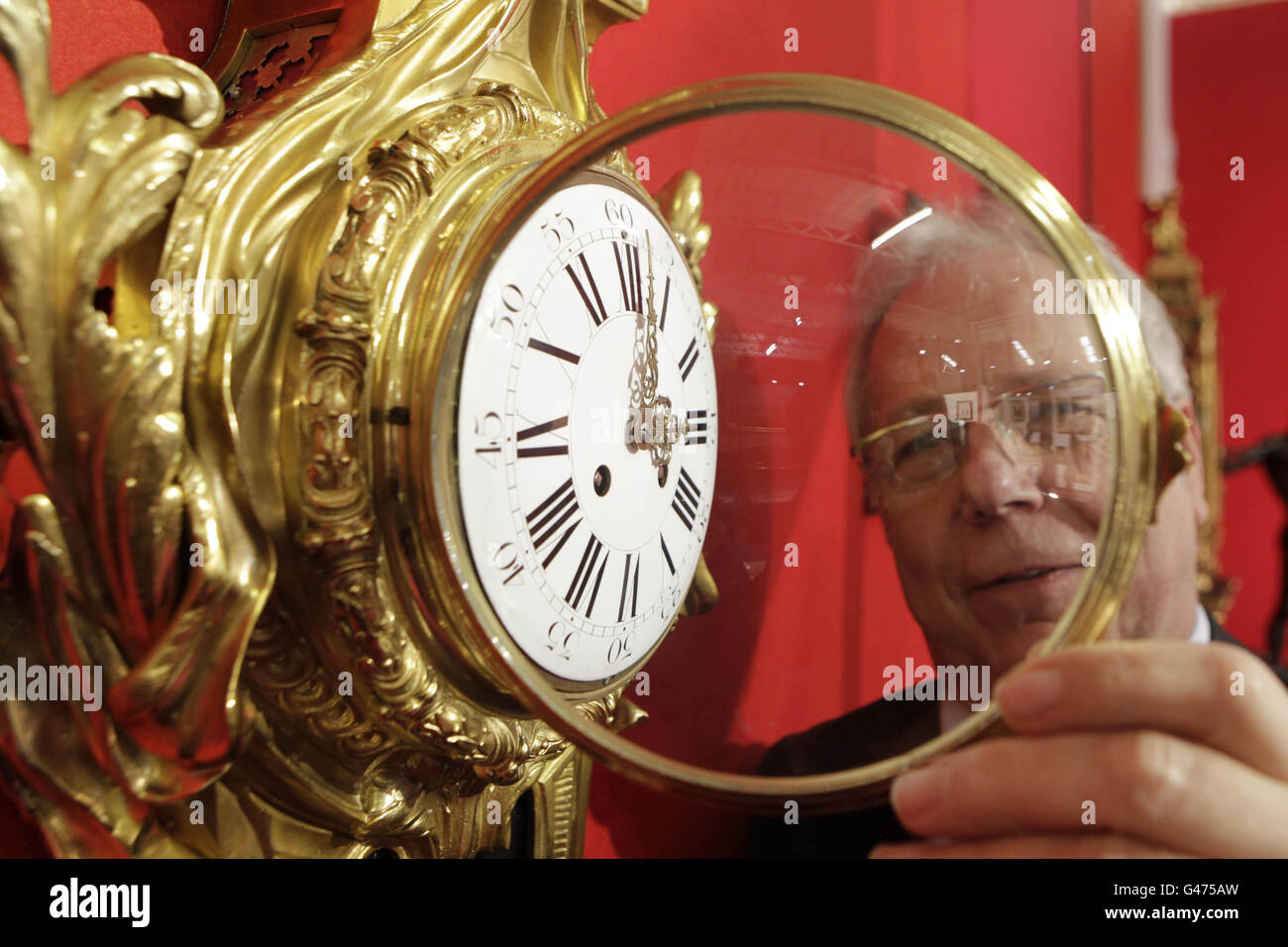 Antique clock dealer Oliver Walsh pictured at the Irish International Art & Antiques Fair which runs this weekend in the RDS in Dublin reminds people to move their clocks forward one hour tomorrow night. Stock Photo