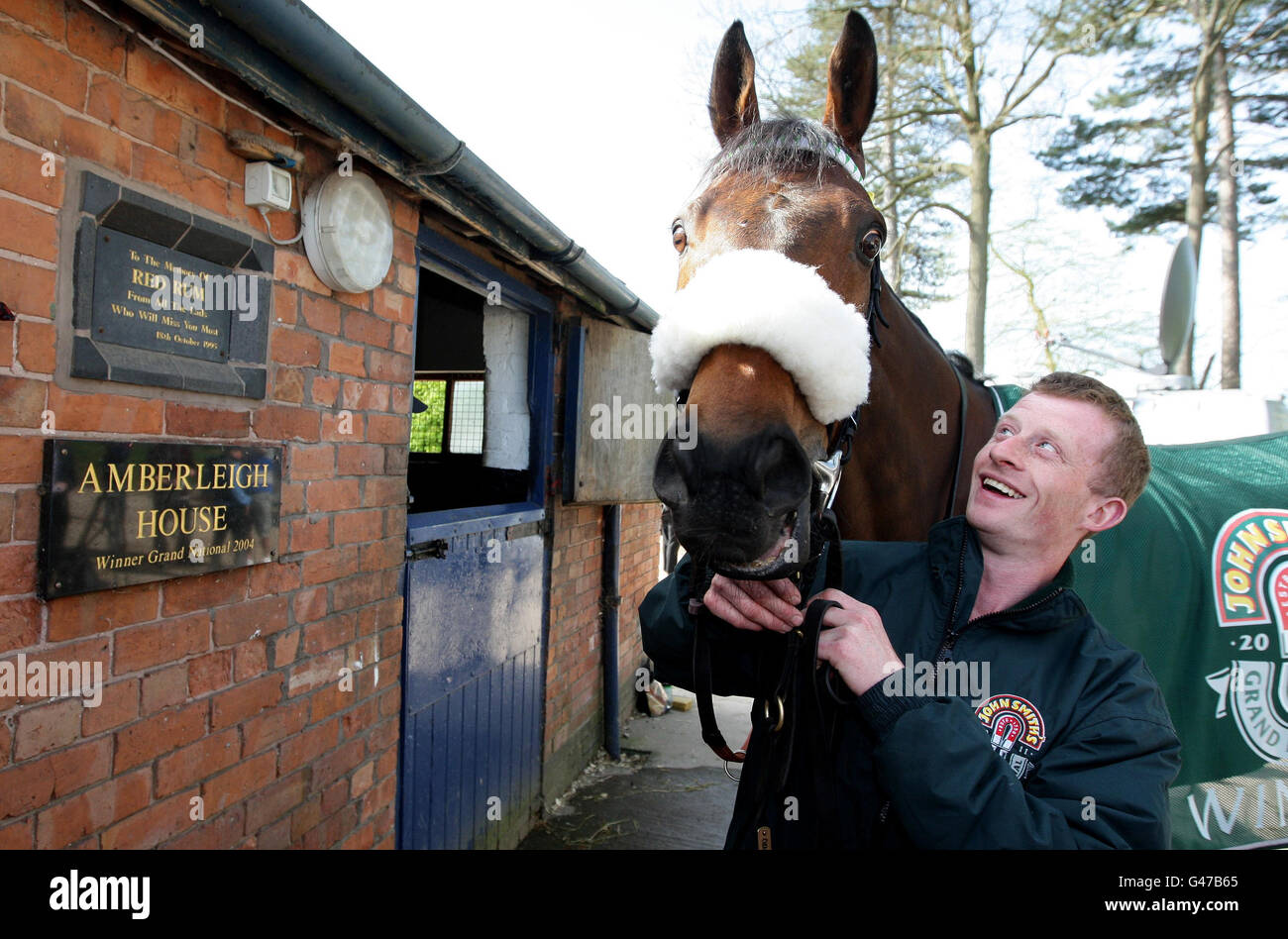 Works rider Edward Bourne smiles at Grand National winner Ballabriggs during a Homecoming Photocall at the stables in Malpas, Cheshire, PRESS ASSOCIATIOIN Photo. Picture date: Sunday April 10, 2011. The win was trainer Donald McCain's first in the race. His father Donald 'Ginger' McCain trained two horses to four National wins, Red Rum 3 times and Amberleigh House in 2004. Photo credit should read: Dave Thompson/PA Wire Stock Photo
