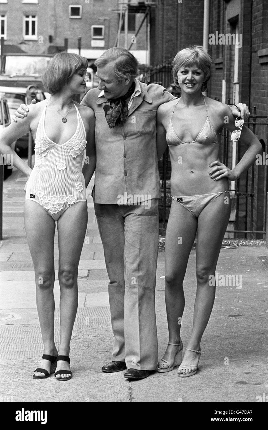 Actor Leslie Phillips (c) with co-stars of the West End comedy 'Sextet' Angela Scoular (l) and Carol Hawkins (r). The ladies were choosing new swimsuits for the show from Nelbarden's 1978 range, Leslie Phillips had gone along to offer his manly views on the final choices. Angela and Carol wear swimsuits in several scenes of the play, which involves six people holidaying on board a luxury Mediterranean cruiser. Leslie Phillips would go on to marry Angela Scoular in 1982. Stock Photo