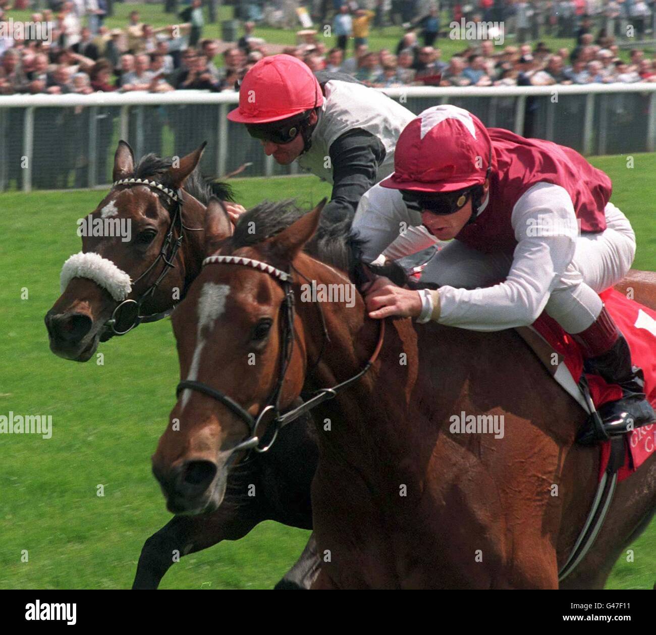 Frankie Dettori(rt) on Papering gets home ahead of Charlotte Corday and Michael Hills to win the Grosvenor Casinos Middleton Stakes at York Races today(Weds).Photo John Giles.PA. Stock Photo
