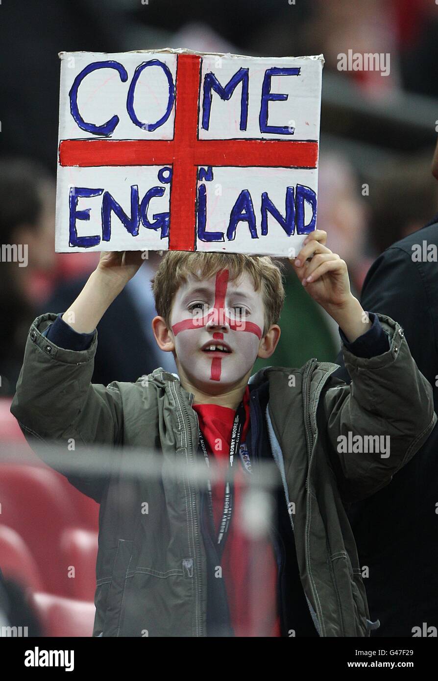Soccer - International Friendly - England v Ghana - Wembley Stadium. A young England fan holds up a sign to show his support Stock Photo