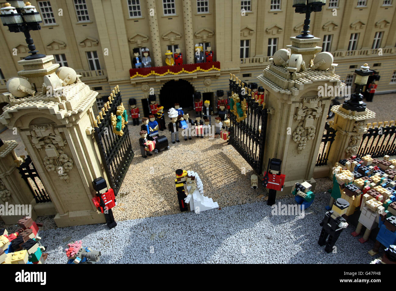 Lego models of Prince William and Kate Middleton share a kiss in front of a model of Buckingham Palace in MINILAND at LEGOLAND Windsor, Berkshire, part of their new royal wedding scene. PRESS ASSOCIATION Photo. Picture date: Monday March 28, 2011. Photo credit should read: Steve Parsons/PA Wire Stock Photo