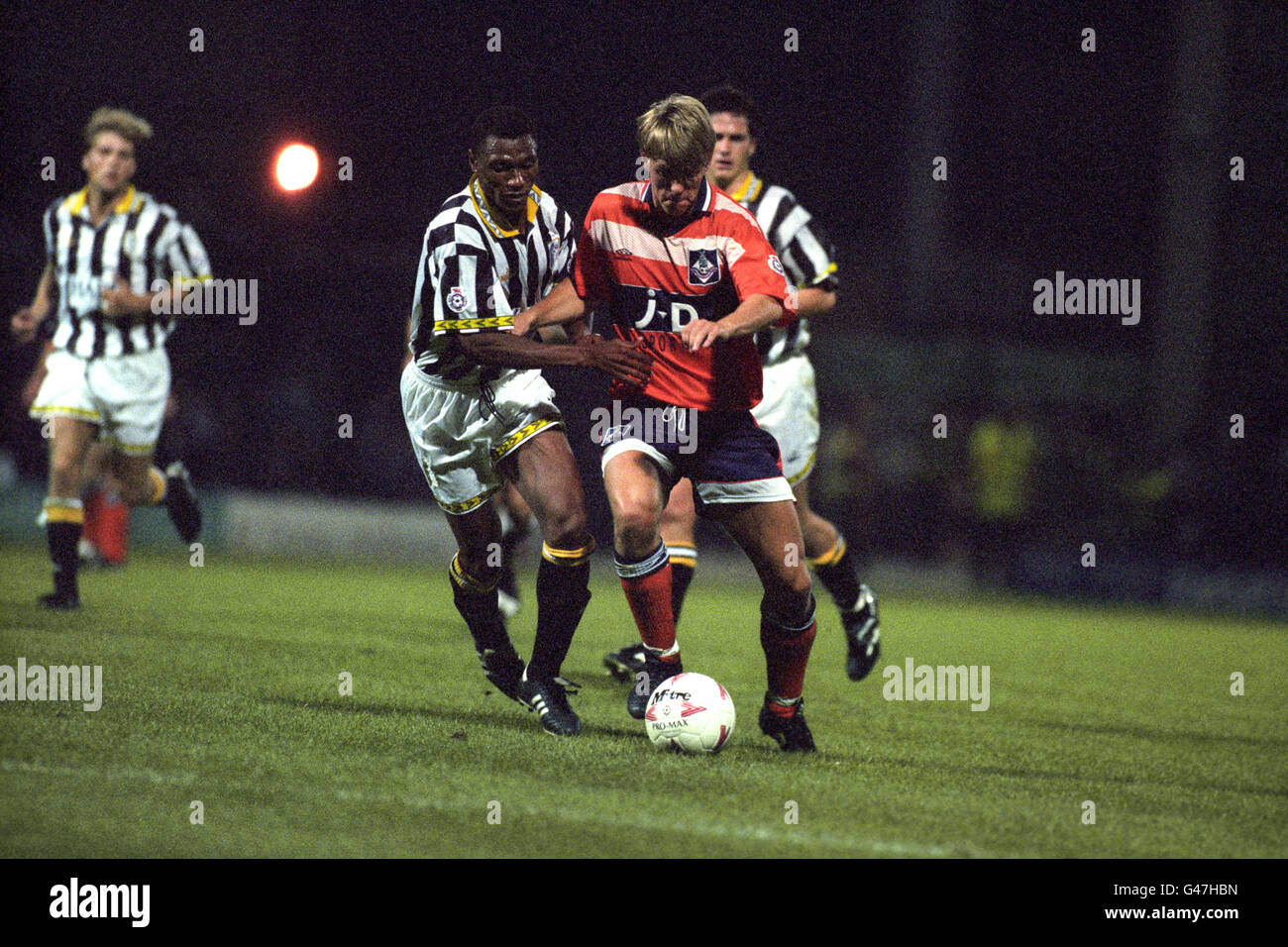 Oldham Athletic's Gunnar Halle holds off Notts County's Michael Emenalo. Stock Photo