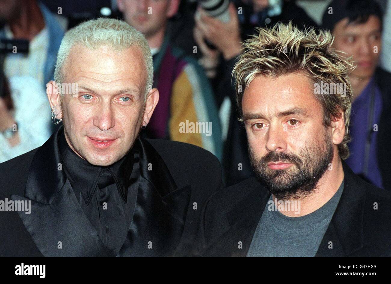 Designer Jean-Paul Gaultier (left) with director Luc Besson at this evening's (Tuesday) London premiere of the sci-fi movie The Fifth Element in Leicester Square. Besson directed the 23rd century fantasy, which stars Bruce Willis, Gary Oldman, Ian Holm and Milla Jovovich, with Gaultier providing futurisitc costumes. Photo by Michael Stephens/PA. Stock Photo