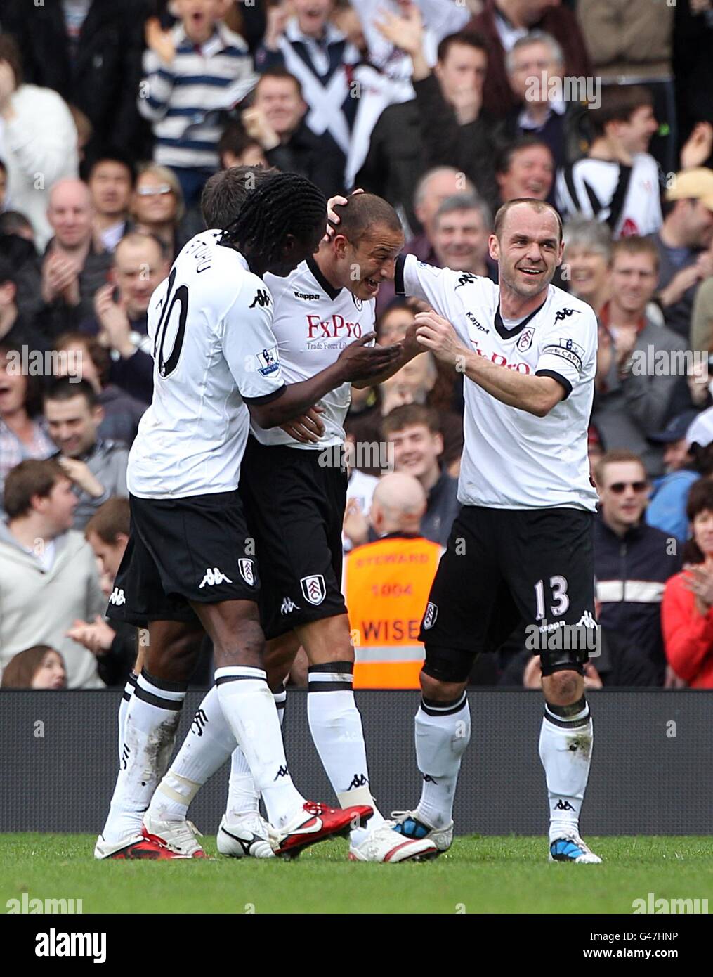 Fulham's Bobby Zamora (centre) celebrates with his team-mates after scoring their second goal Stock Photo